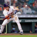 HOUSTON, TEXAS - APRIL 26: Myles Straw #3 of the Houston Astros bunts during the fourth inning against the Seattle Mariners at Minute Maid Park on April 26, 2021 in Houston, Texas. (Photo by Carmen Mandato/Getty Images)
