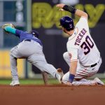 HOUSTON, TEXAS - APRIL 26: Kyle Tucker #30 of the Houston Astros is tagged out at second by J.P. Crawford #3 of the Seattle Mariners during the fourth inning at Minute Maid Park on April 26, 2021 in Houston, Texas. (Photo by Carmen Mandato/Getty Images)
