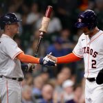 HOUSTON, TEXAS - APRIL 27: Alex Bregman #2 of the Houston Astros high fives Myles Straw #3 after scoring during the fourth inning of their game against the Seattle Mariners at Minute Maid Park on April 27, 2021 in Houston, Texas. (Photo by Carmen Mandato/Getty Images)