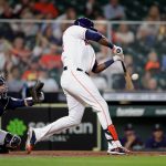 HOUSTON, TEXAS - APRIL 27: Yordan Alvarez #44 of the Houston Astros hits a sacrfice fly to left field during the fourth inning against the Seattle Mariners at Minute Maid Park on April 27, 2021 in Houston, Texas. (Photo by Carmen Mandato/Getty Images)