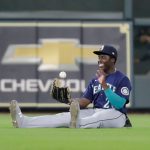HOUSTON, TEXAS - APRIL 29: Taylor Trammell #20 of the Seattle Mariners flips the ball out of his glove after making a sliding catch to end the game against the Houston Astros at Minute Maid Park on April 29, 2021 in Houston, Texas. Seattle Mariners won 1-0. (Photo by Bob Levey/Getty Images)