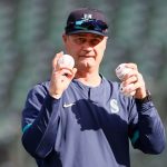 SEATTLE, WASHINGTON - APRIL 30: Manager Scott Servais of the Seattle Mariners pitches during warm ups before the game against the Los Angeles Angels at T-Mobile Park on April 30, 2021 in Seattle, Washington. (Photo by Steph Chambers/Getty Images)