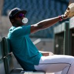 SEATTLE, WASHINGTON - APRIL 30: Taylor Trammell #20 of the Seattle Mariners looks on from the dugout before the game against the Los Angeles Angels at T-Mobile Park on April 30, 2021 in Seattle, Washington. (Photo by Steph Chambers/Getty Images)