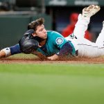 SEATTLE, WASHINGTON - APRIL 30: Ty France #23 of the Seattle Mariners scores a run against the Los Angeles Angels in the third inning at T-Mobile Park on April 30, 2021 in Seattle, Washington. (Photo by Steph Chambers/Getty Images)