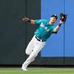 SEATTLE, WASHINGTON - APRIL 30: Sam Haggerty #0 of the Seattle Mariners catches a fly ball for an out in the seventh inning against the Los Angeles Angels at T-Mobile Park on April 30, 2021 in Seattle, Washington. (Photo by Steph Chambers/Getty Images)