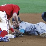 ARLINGTON, TX - MAY 7: J.P. Crawford #3 of the Seattle Mariners is tagged out trying to steal second base by Nick Solak #15 of the Texas Rangers during the sixth inning at Globe Life Field on May 7, 2021 in Arlington, Texas. (Photo by Ron Jenkins/Getty Images)