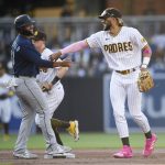 SAN DIEGO, CA - MAY 22: Fernando Tatis Jr. #23 of the San Diego Padres jokes with Justus Sheffield #33 of the Seattle Mariners after turning a double play during the second inning of a baseball game at Petco Park on May 22, 2021 in San Diego, California.  (Photo by Denis Poroy/Getty Images)