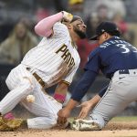 SAN DIEGO, CA - MAY 22: Fernando Tatis Jr. #23 of the San Diego Padres scores as Justus Sheffield #33 of the Seattle Mariners loses the ball  during the fifth inning of a baseball game  at Petco Park on May 22, 2021 in San Diego, California.  (Photo by Denis Poroy/Getty Images)