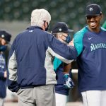 SEATTLE, WASHINGTON - MAY 03: John Stanton, chairman of the board of the Seattle Mariners, greets Kyle Lewis #1 before the game against the Baltimore Orioles at T-Mobile Park on May 03, 2021 in Seattle, Washington. (Photo by Steph Chambers/Getty Images)