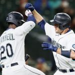 SEATTLE, WASHINGTON - MAY 03: Tom Murphy #2 and Taylor Trammell #20 of the Seattle Mariners react after Murphy's home run against the Baltimore Orioles in the fifth inning at T-Mobile Park on May 03, 2021 in Seattle, Washington. (Photo by Steph Chambers/Getty Images)