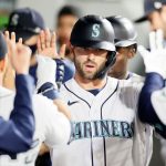 SEATTLE, WASHINGTON - MAY 03: Mitch Haniger #17 of the Seattle Mariners celebrates in the dugout after his two-run home run against the Baltimore Orioles in the eighth inning at T-Mobile Park on May 03, 2021 in Seattle, Washington. (Photo by Steph Chambers/Getty Images)