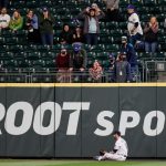 SEATTLE, WASHINGTON - MAY 03: Kyle Lewis #1 and Mitch Haniger #17 of the Seattle Mariners react after a home run by Cedric Mullins of the Baltimore Orioles in the eighth inning at T-Mobile Park on May 03, 2021 in Seattle, Washington. (Photo by Steph Chambers/Getty Images)