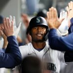 SEATTLE, WASHINGTON - MAY 04: Kyle Lewis #1 of the Seattle Mariners celebrates with his teammates in the dugout after his three-run home run against the Baltimore Orioles during the eighth inning at T-Mobile Park on May 04, 2021 in Seattle, Washington. (Photo by Steph Chambers/Getty Images)