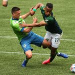 PORTLAND, OREGON - MAY 09: Shane O'Neill #27 of Seattle Sounders and Jeremy Ebobisse #17 of Portland Timbers battle for possession in the second half at Providence Park on May 09, 2021 in Portland, Oregon. (Photo by Abbie Parr/Getty Images)