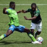 PORTLAND, OREGON - MAY 09: Yeimar Gomez #28 of Seattle Sounders and Yimmi Chara #23 of Portland Timbers battle for possession in the second half at Providence Park on May 09, 2021 in Portland, Oregon. (Photo by Abbie Parr/Getty Images)