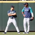 SEATTLE, WASHINGTON - MAY 13: Jarred Kelenic #10 and Kyle Lewis #1 of the Seattle Mariners talk in the outfield before the game against the Cleveland Indians at T-Mobile Park on May 13, 2021 in Seattle, Washington. (Photo by Steph Chambers/Getty Images)