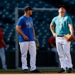 SEATTLE, WASHINGTON - MAY 13: Ty France #23 and Kyle Seager #15 of the Seattle Mariners share in a moment before the game against the Cleveland Indians at T-Mobile Park on May 13, 2021 in Seattle, Washington. (Photo by Steph Chambers/Getty Images)