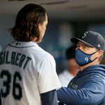 SEATTLE, WASHINGTON - MAY 13: Manager Scott Servais #9 speaks with Logan Gilbert #36 of the Seattle Mariners after the top of the fourth inning against the Cleveland Indians in his MLB debut at T-Mobile Park on May 13, 2021 in Seattle, Washington. (Photo by Steph Chambers/Getty Images)