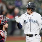SEATTLE, WASHINGTON - MAY 13: Dylan Moore #25 of the Seattle Mariners reacts after his two run home run against the Cleveland Indians during the eighth inning at T-Mobile Park on May 13, 2021 in Seattle, Washington. (Photo by Steph Chambers/Getty Images)