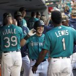SEATTLE, WASHINGTON - MAY 14: Jarred Kelenic #10 of the Seattle Mariners reacts with Kyle Lewis #1 after his two run home run against the Cleveland Indians during the third inning at T-Mobile Park on May 14, 2021 in Seattle, Washington. (Photo by Steph Chambers/Getty Images)