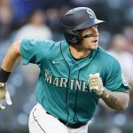 SEATTLE, WASHINGTON - MAY 14: Jarred Kelenic #10 of the Seattle Mariners hits a two run home run on his first MLB hit during the third inning against the Cleveland Indians at T-Mobile Park on May 14, 2021 in Seattle, Washington. (Photo by Steph Chambers/Getty Images)