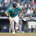 SEATTLE, WASHINGTON - MAY 14: Jarred Kelenic #10 of the Seattle Mariners hits a two run home run on his first MLB hit during the third inning against the Cleveland Indians at T-Mobile Park on May 14, 2021 in Seattle, Washington. (Photo by Steph Chambers/Getty Images)