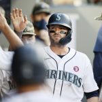 SEATTLE, WASHINGTON - MAY 15: Mitch Haniger #17 of the Seattle Mariners reacts in the dugout after scoring against the Cleveland Indians during the fifth inning at T-Mobile Park on May 15, 2021 in Seattle, Washington. (Photo by Steph Chambers/Getty Images)