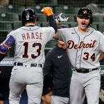 SEATTLE, WASHINGTON - MAY 17: Eric Haase #13 and Jake Rogers #34 of the Detroit Tigers react after a home run by Haase during the ninth inning against the Seattle Mariners at T-Mobile Park on May 17, 2021 in Seattle, Washington. (Photo by Steph Chambers/Getty Images)