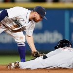 SEATTLE, WASHINGTON - MAY 17: Donovan Walton #31 of the Seattle Mariners tags out JaCoby Jones #21 of the Detroit Tigers during the seventh inning at T-Mobile Park on May 17, 2021 in Seattle, Washington. (Photo by Steph Chambers/Getty Images)