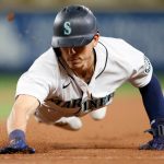 SEATTLE, WASHINGTON - MAY 17: Sam Haggerty #0 of the Seattle Mariners dives back to first base during the fifth inning against the Detroit Tigers at T-Mobile Park on May 17, 2021 in Seattle, Washington. (Photo by Steph Chambers/Getty Images)