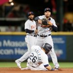 SEATTLE, WASHINGTON - MAY 17: Jonathan Schoop #7 of the Detroit Tigers turns a double play over Jose Marmolejos #26 of the Seattle Mariners during the second inning at T-Mobile Park on May 17, 2021 in Seattle, Washington. (Photo by Steph Chambers/Getty Images)