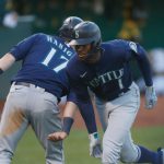 OAKLAND, CALIFORNIA - MAY 24: Kyle Lewis #1 of the Seattle Mariners celebrates with Mitch Haniger #17 after hitting a two-run home run in the top of the third inning against the Oakland Athletics at RingCentral Coliseum on May 24, 2021 in Oakland, California. (Photo by Lachlan Cunningham/Getty Images)