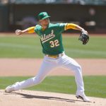 OAKLAND, CALIFORNIA - MAY 26: James Kaprielian #32 of the Oakland Athletics pitches in the top of the first inning against the Seattle Mariners at RingCentral Coliseum on May 26, 2021 in Oakland, California. (Photo by Lachlan Cunningham/Getty Images)