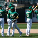 OAKLAND, CALIFORNIA - MAY 26: Jake Diekman #35, Ramon Laureano #22, Matt Chapman #26 and Elvis Andrus #17 of the Oakland Athletics celebrate after a win against the Seattle Mariners at RingCentral Coliseum on May 26, 2021 in Oakland, California. (Photo by Lachlan Cunningham/Getty Images)