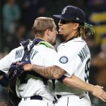 SEATTLE, WASHINGTON - MAY 27: Tom Murphy #2 and Keynan Middleton #99 of the Seattle Mariners celebrate after defeating the Texas Rangers 5-0 at T-Mobile Park on May 27, 2021 in Seattle, Washington. (Photo by Abbie Parr/Getty Images)