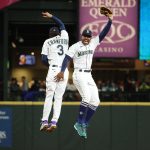 SEATTLE, WASHINGTON - MAY 27: J.P. Crawford #3 and Kyle Lewis #1 of the Seattle Mariners celebrate after defeating the Texas Rangers 5-0 at T-Mobile Park on May 27, 2021 in Seattle, Washington. (Photo by Abbie Parr/Getty Images)