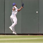 SEATTLE, WASHINGTON - MAY 30: Adolis Garcia #53 of the Texas Rangers commits a fielding error while attempting to catch a hit by Kyle Lewis #1 of the Seattle Mariners during the third inning at T-Mobile Park on May 30, 2021 in Seattle, Washington. (Photo by Abbie Parr/Getty Images)