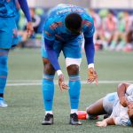 SEATTLE, WASHINGTON - MAY 30: Nouhou Tolo #5 of Seattle Sounders checks on Cecilio Dominguez #10 of Austin FC after a stoppage of play during the second half at Lumen Field on May 30, 2021 in Seattle, Washington. (Photo by Steph Chambers/Getty Images)