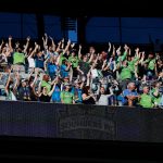 SEATTLE, WASHINGTON - MAY 30: Fans cheer before the game between the Seattle Sounders and the Austin FC at Lumen Field on May 30, 2021 in Seattle, Washington. (Photo by Steph Chambers/Getty Images)