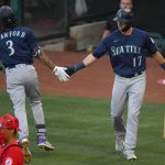 ANAHEIM, CA - JUNE 04: J.P. Crawford #3 of the Seattle Mariners is greeted by Mitch Haniger #17 after hitting a solo home run in the first inning of the game against the Los Angeles Angels at Angel Stadium of Anaheim on June 4, 2021 in Anaheim, California. (Photo by Jayne Kamin-Oncea/Getty Images)