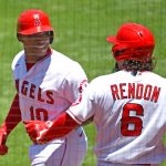 ANAHEIM, CA - JUNE 06: Justin Upton #10 is greeted by Anthony Rendon #6 of the Los Angeles Angels after hitting a solo home run in the first inning of the game against the Seattle Mariners at Angel Stadium of Anaheim on June 6, 2021 in Anaheim, California. (Photo by Jayne Kamin-Oncea/Getty Images)