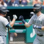 DETROIT, MI -  JUNE 10:  Mitch Haniger #17 of the Seattle Mariners rounds is congratulated by Kyle Seager #15 after hitting a solo home run against the Detroit Tigers during the first inning at Comerica Park on June 10, 2021, in Detroit, Michigan. (Photo by Duane Burleson/Getty Images)