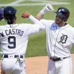 DETROIT, MI -  JUNE 10:  Robbie Grossman #8 of the Detroit Tigers celebrates with Willi Castro #9 after hitting a two-run home run against the Seattle Mariners during the sixth inning at Comerica Park on June 10, 2021, in Detroit, Michigan. (Photo by Duane Burleson/Getty Images)