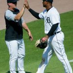 DETROIT, MI -  JUNE 10:  Manager A.J. Hinch #14 of the Detroit Tigers high-fives Jonathan Schoop #7 after a 8-3 win over the Seattle Mariners at Comerica Park on June 10, 2021, in Detroit, Michigan. (Photo by Duane Burleson/Getty Images)
