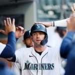 SEATTLE, WASHINGTON - JUNE 01: Mitch Haniger #17 of the Seattle Mariners slaps hands in the dugout after scoring a run on a double off the bat of Kyle Seager in the third inning against the Oakland Athletics at T-Mobile Park on June 01, 2021 in Seattle, Washington. (Photo by Steph Chambers/Getty Images)