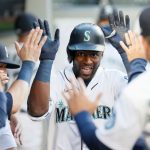 SEATTLE, WASHINGTON - JUNE 01: Taylor Trammell #20 of the Seattle Mariners reacts after his home run against the Oakland Athletics during the fourth inning at T-Mobile Park on June 01, 2021 in Seattle, Washington. (Photo by Steph Chambers/Getty Images)