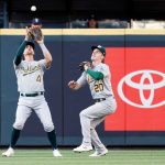 SEATTLE, WASHINGTON - JUNE 01: Chad Pinder #4 of the Oakland Athletics catches a fly ball as Mark Canha #20 watches during the second inning against the Seattle Mariners at T-Mobile Park on June 01, 2021 in Seattle, Washington. (Photo by Steph Chambers/Getty Images)