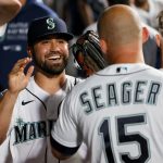SEATTLE, WASHINGTON - JUNE 01: Jack Mayfield #8 of the Seattle Mariners celebrates in the dugout in the ninth inning against the Oakland Athletics at T-Mobile Park on June 01, 2021 in Seattle, Washington. (Photo by Steph Chambers/Getty Images)