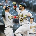 SEATTLE, WASHINGTON - JUNE 02: Matt Olson #28 and Mitch Moreland #18 of the Oakland Athletics celebrate after Moreland's two run home run in the third inning during Lou Gehrig Day at T-Mobile Park on June 02, 2021 in Seattle, Washington. (Photo by Steph Chambers/Getty Images)
