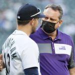 SEATTLE, WASHINGTON - JUNE 02: Jacob Nottingham #13 of the Seattle Mariners and Phil Green, founding member of Major League Baseball’s Lou Gehrig Day Committtee and member of the 1991 University of Washington national championship football team, greet one another during Lou Gehrig Day before the game between the Seattle Mariners and the Oakland Athletics at T-Mobile Park on June 02, 2021 in Seattle, Washington. (Photo by Steph Chambers/Getty Images)